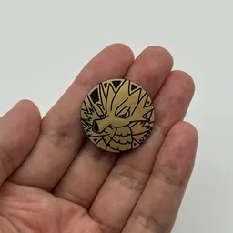 In hand, from Pokémon Coin Fan, full size