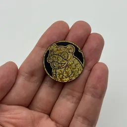 In hand, from Pokémon Coin Fan, full size