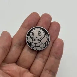 In hand, from Pokémon Coin Fan, full size
