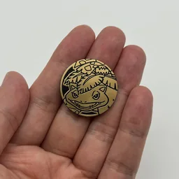 In hand, from Pokémon Coin Fan, full size
