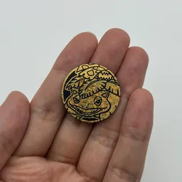 In hand, from Pokémon Coin Fan, full size