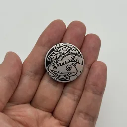 In hand, from Pokémon Coin Fan, full size