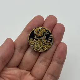 In hand, from Pokémon Coin Fan, full size