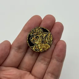 In hand, from Pokémon Coin Fan, full size