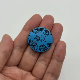 In hand, from Pokémon Coin Fan, full size