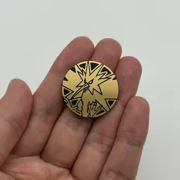 In hand, from Pokémon Coin Fan, full size