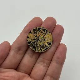 In hand, from Pokémon Coin Fan, full size