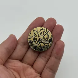 In hand, from Pokémon Coin Fan, full size