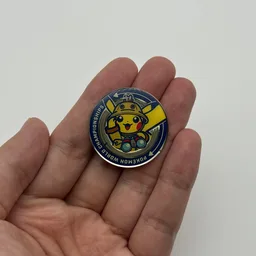 In hand, from Pokémon Coin Fan, full size