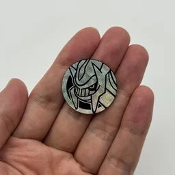 In hand, from Pokémon Coin Fan, full size