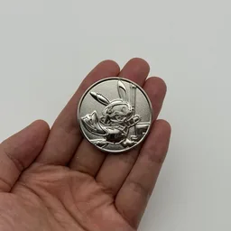 In hand, from Pokémon Coin Fan, full size