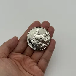 In hand, from Pokémon Coin Fan, full size