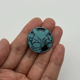 In hand, from Pokémon Coin Fan, full size