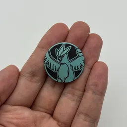 In hand, from Pokémon Coin Fan, full size
