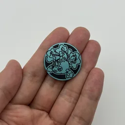 In hand, from Pokémon Coin Fan, full size