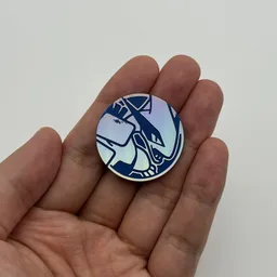 In hand, from Pokémon Coin Fan, full size