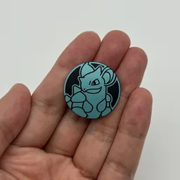 In hand, from Pokémon Coin Fan, full size