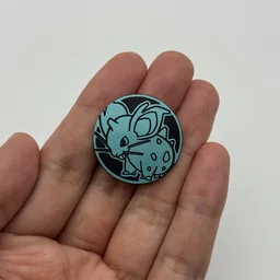 In hand, from Pokémon Coin Fan, full size