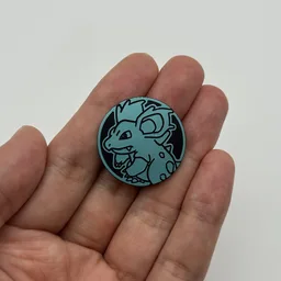 In hand, from Pokémon Coin Fan, full size