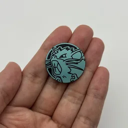 In hand, from Pokémon Coin Fan, full size