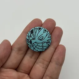 In hand, from Pokémon Coin Fan, full size