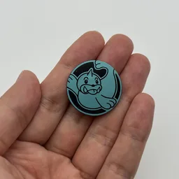 In hand, from Pokémon Coin Fan, full size