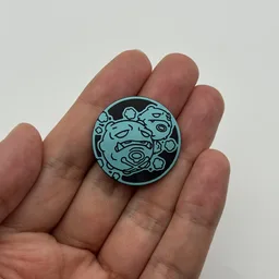 In hand, from Pokémon Coin Fan, full size