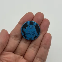 In hand, from Pokémon Coin Fan, full size