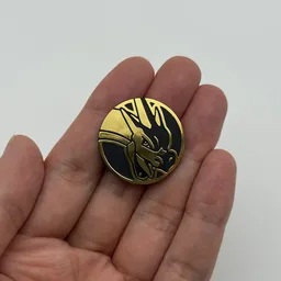 In hand, from Pokémon Coin Fan, full size