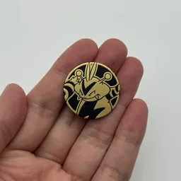 In hand, from Pokémon Coin Fan, full size