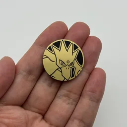 In hand, from Pokémon Coin Fan, full size