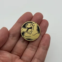 In hand, from Pokémon Coin Fan, full size