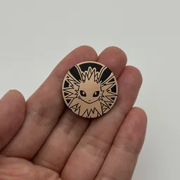 In hand, from Pokémon Coin Fan, full size