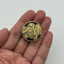 In hand, from Pokémon Coin Fan, full size