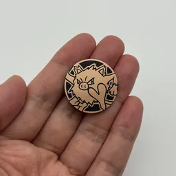 In hand, from Pokémon Coin Fan, full size