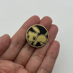 In hand, from Pokémon Coin Fan, full size
