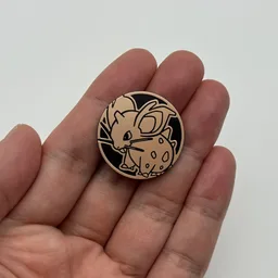 In hand, from Pokémon Coin Fan, full size