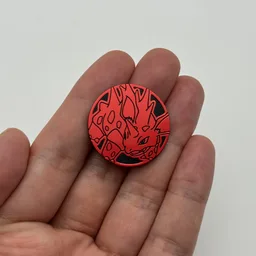 In hand, from Pokémon Coin Fan, full size