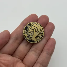 In hand, from Pokémon Coin Fan, full size