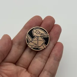In hand, from Pokémon Coin Fan, full size