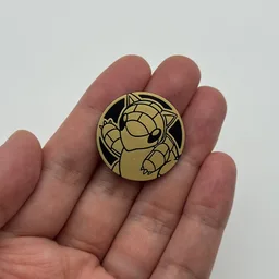 In hand, from Pokémon Coin Fan, full size