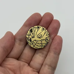 In hand, from Pokémon Coin Fan, full size