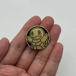 In hand, from Pokémon Coin Fan, full size