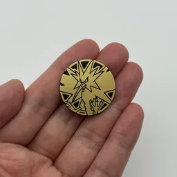 In hand, from Pokémon Coin Fan, full size