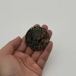 In hand, from Pokémon Coin Fan, full size