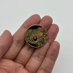 In hand, from Pokémon Coin Fan, full size