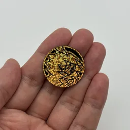 In hand, from Pokémon Coin Fan, full size