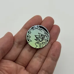 In hand, from Pokémon Coin Fan, full size