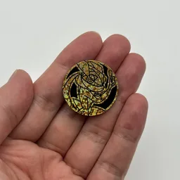In hand, from Pokémon Coin Fan, full size
