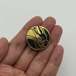 In hand, from Pokémon Coin Fan, full size